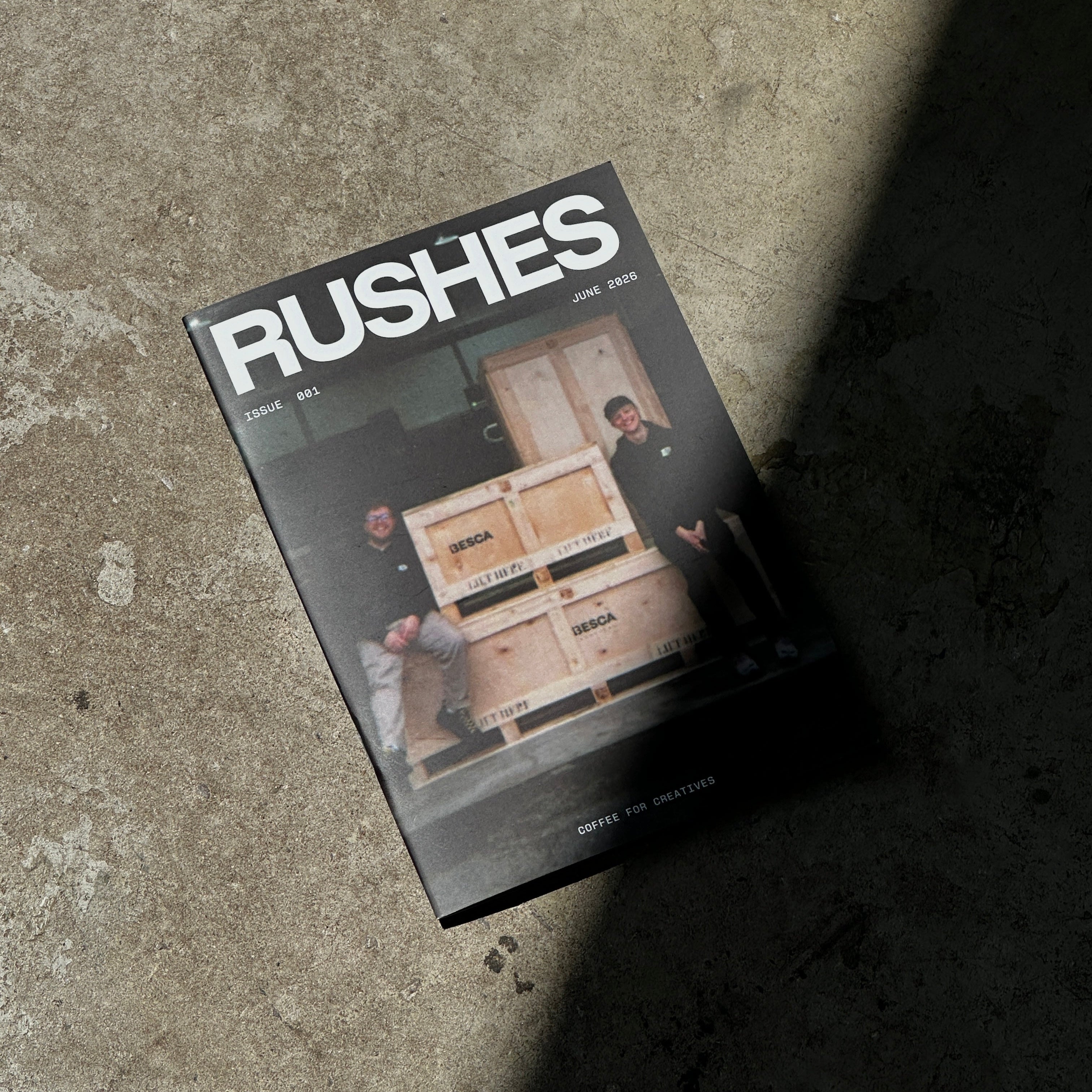 Book titled 'Rushes' on a concrete surface